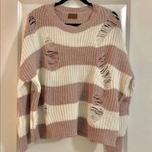 Distressed pink and white sweater